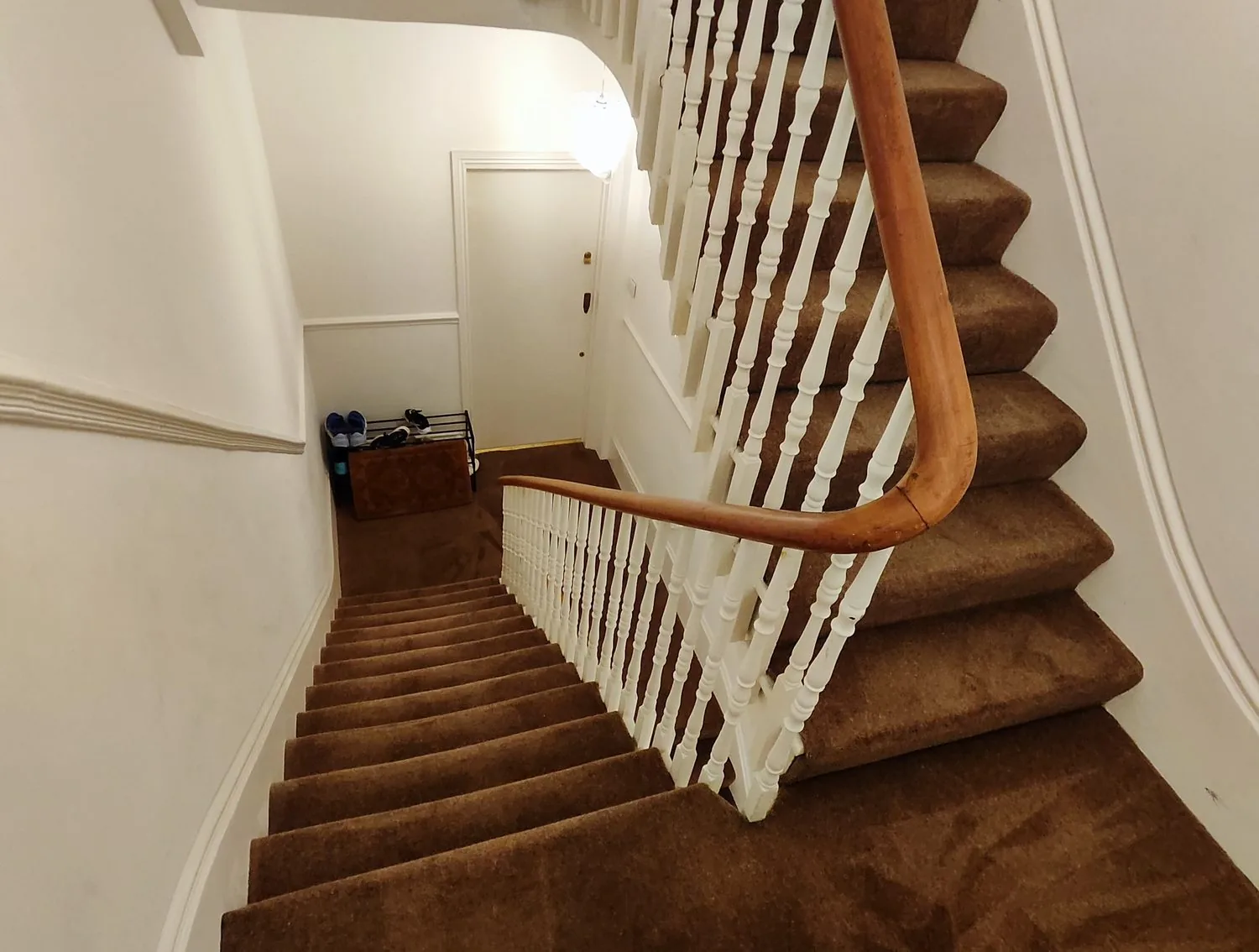 Freshly cleaned carpet on the communal staircase of a London residential block